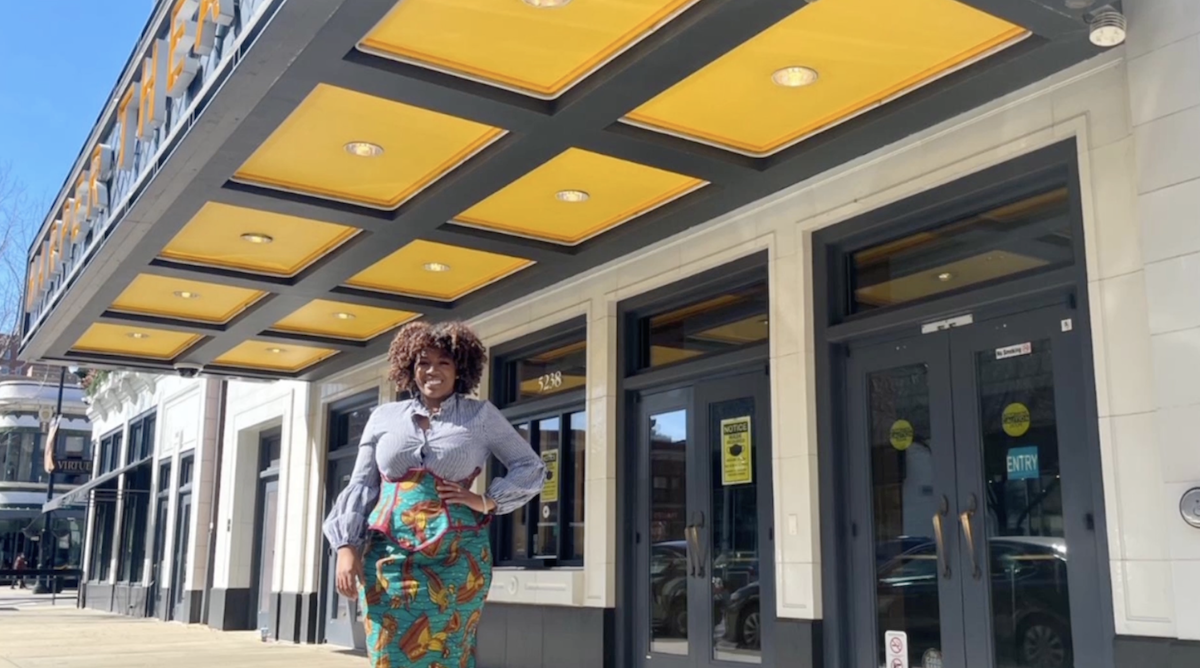 photo of Tayler Ulmer standing on the sidewalk outside Harper Theater in Chicago.